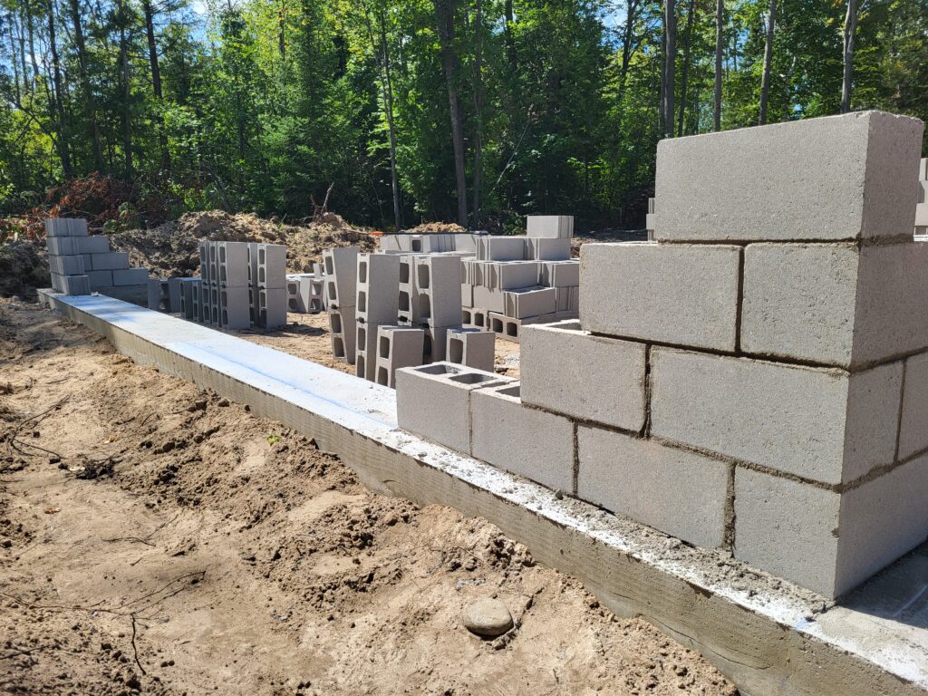 Concrete footings with brickwork going in.